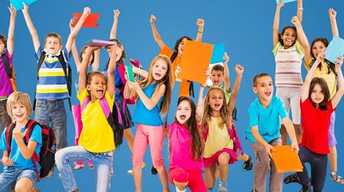 young kids hold school supplies