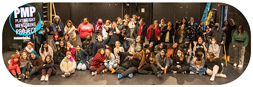 a large group of young actors on a stage