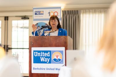 woman speaking at a podium