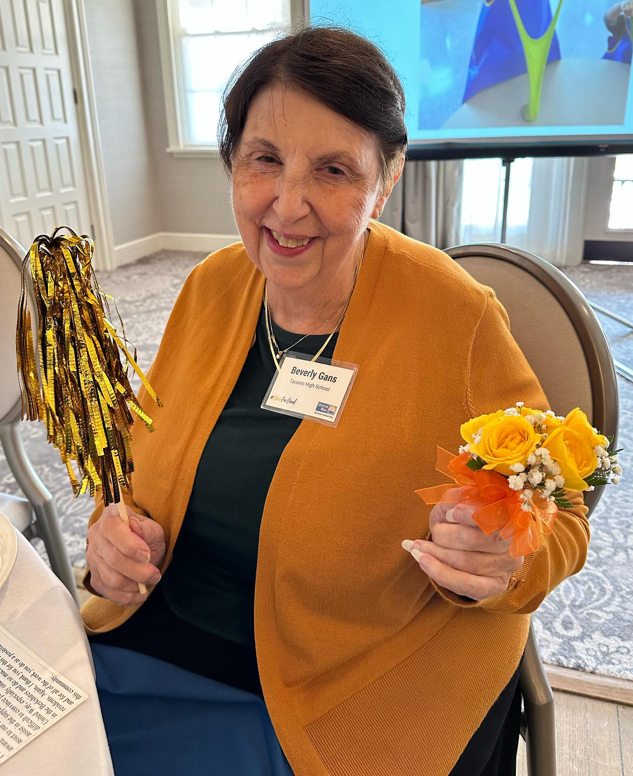 beverly gans with pom pom and flowers