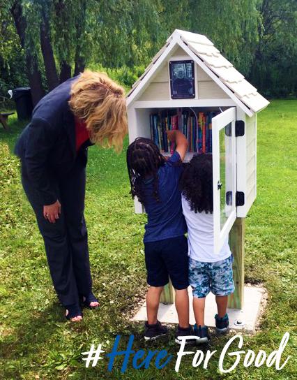 Children fill a book house