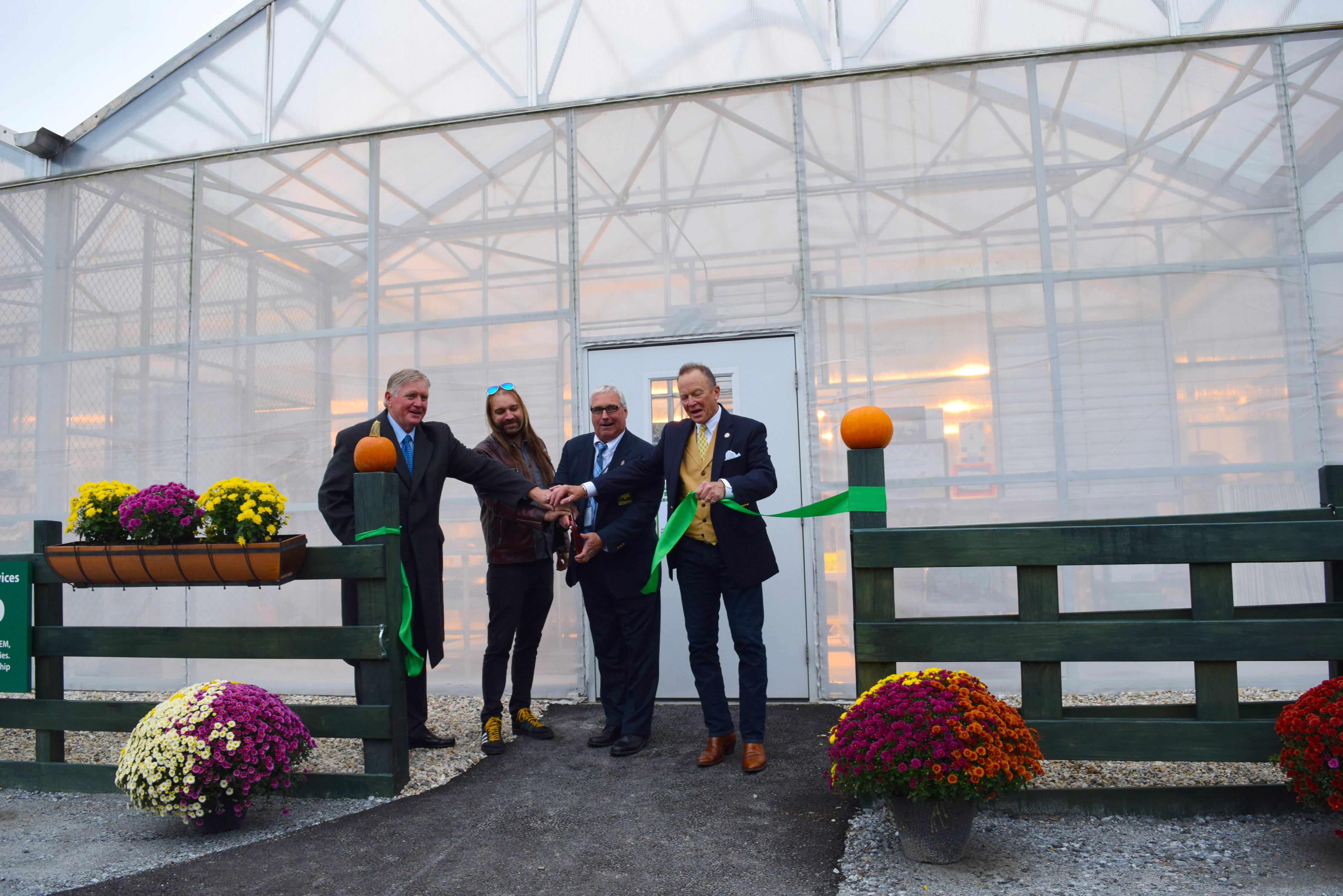 Jack Quinn, Sam Fleming, Sheriff Bowler and Robin McGraw cut ribbon to aquaponics lab