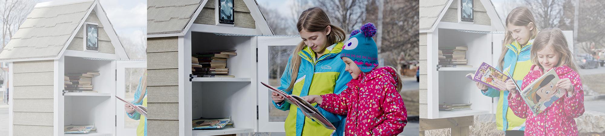 Two young girls read books in front of Book House