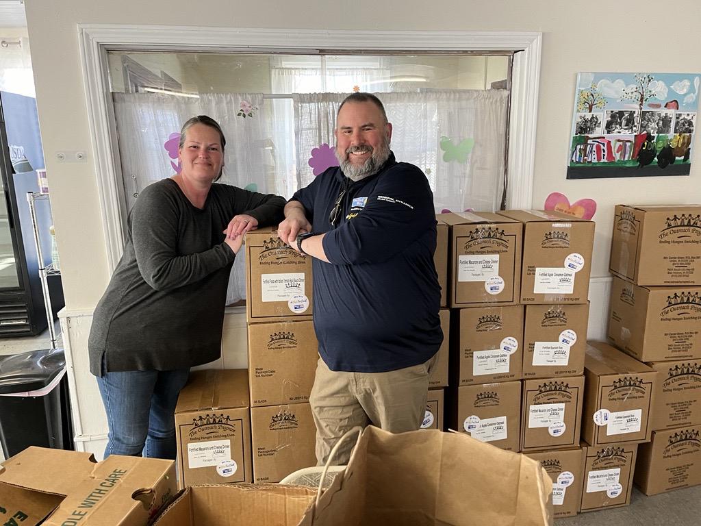 The Christian Center receives meals | Karen Ryan, Food Director and Services Coordinator, with BUW's Tom Bernard