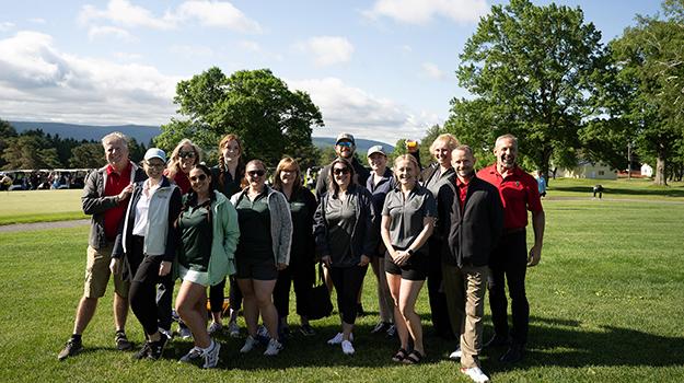 group of women and men at a golf course